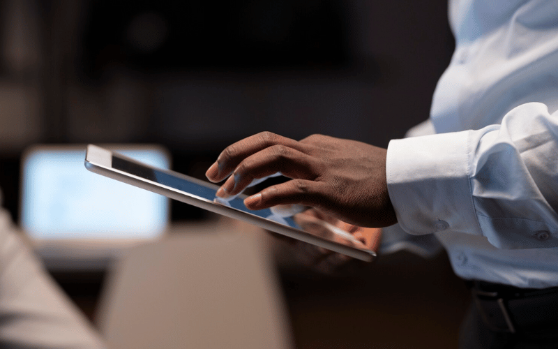 Image of a man making a purchase on a tablet