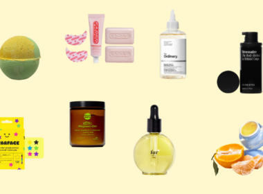 Assorted skincare, body care, and fragrance products on yellow