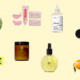 Assorted skincare, body care, and fragrance products on yellow